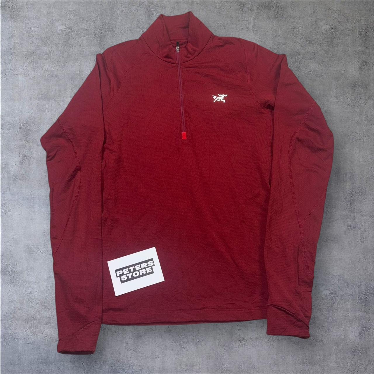 Red Arcteryx fleece