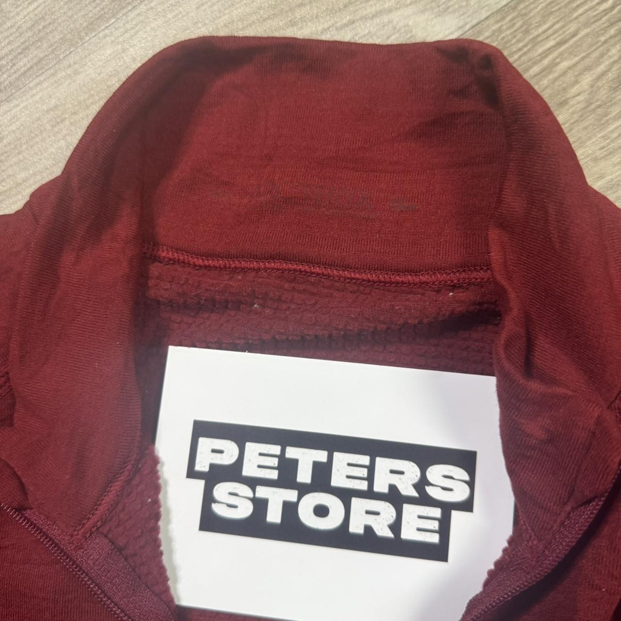 Red Arcteryx fleece