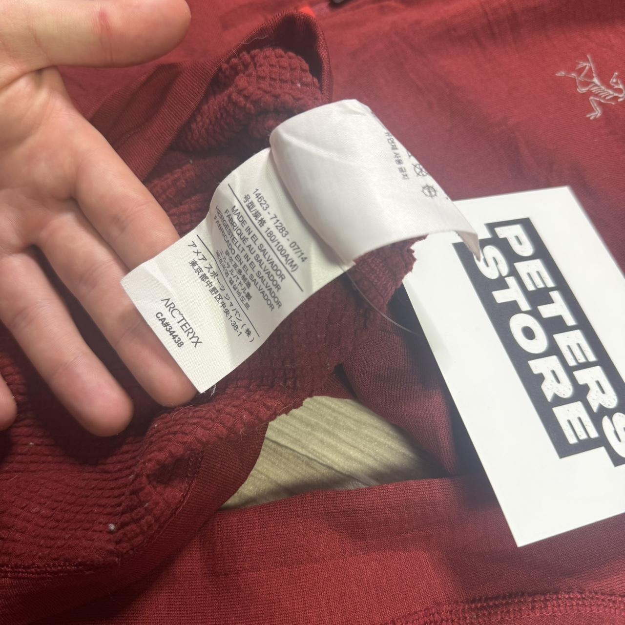 Red Arcteryx fleece
