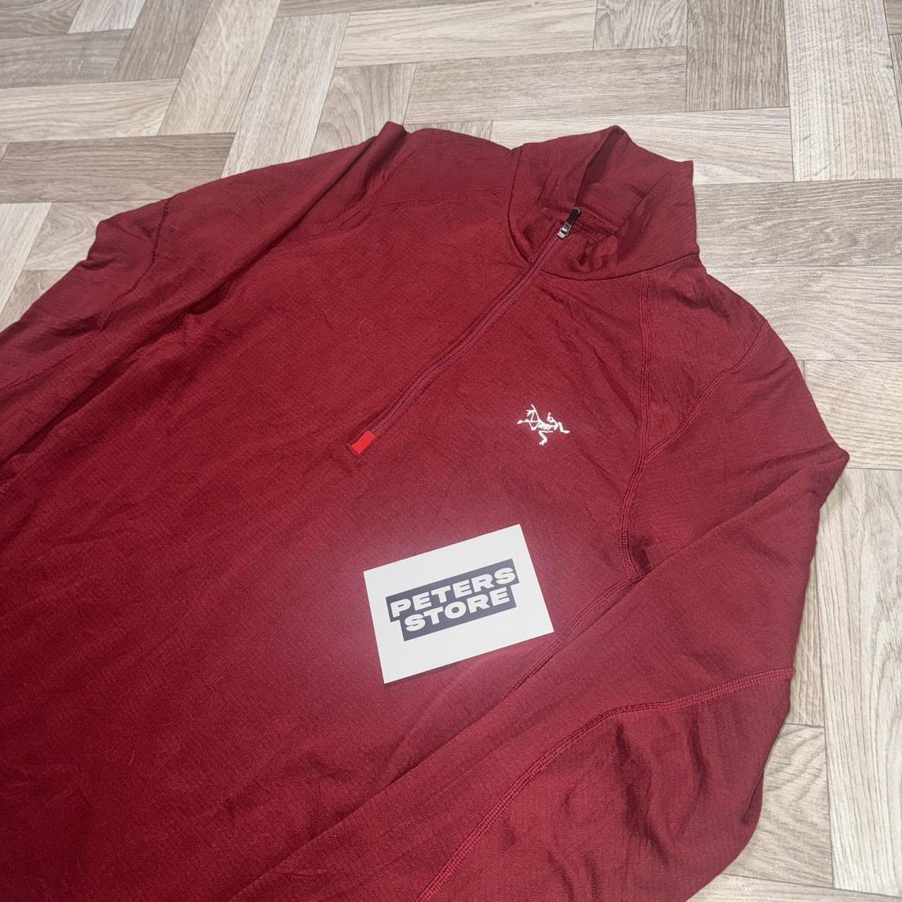 Red Arcteryx fleece