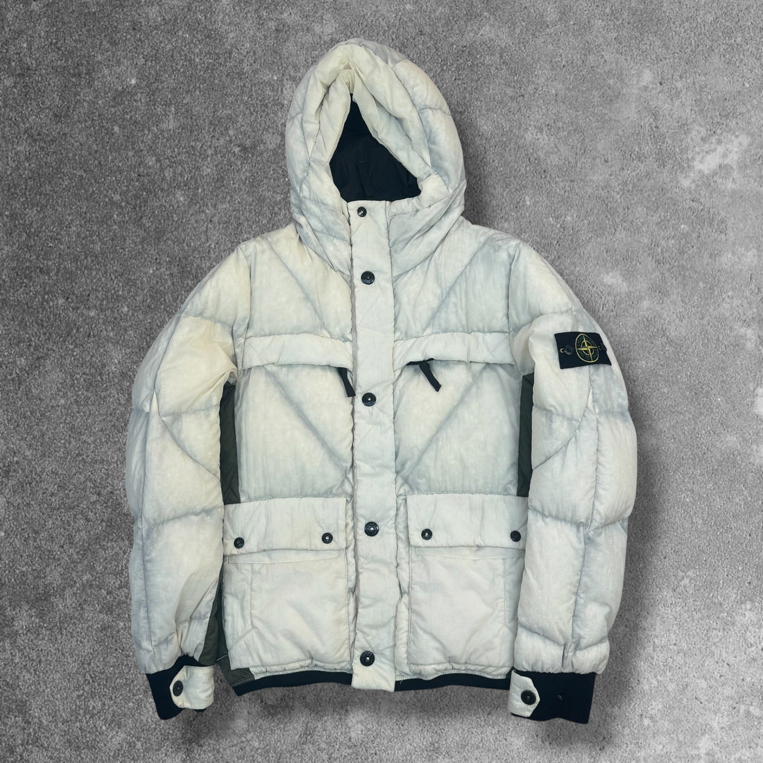 Stone Island puffer jacket laid flat