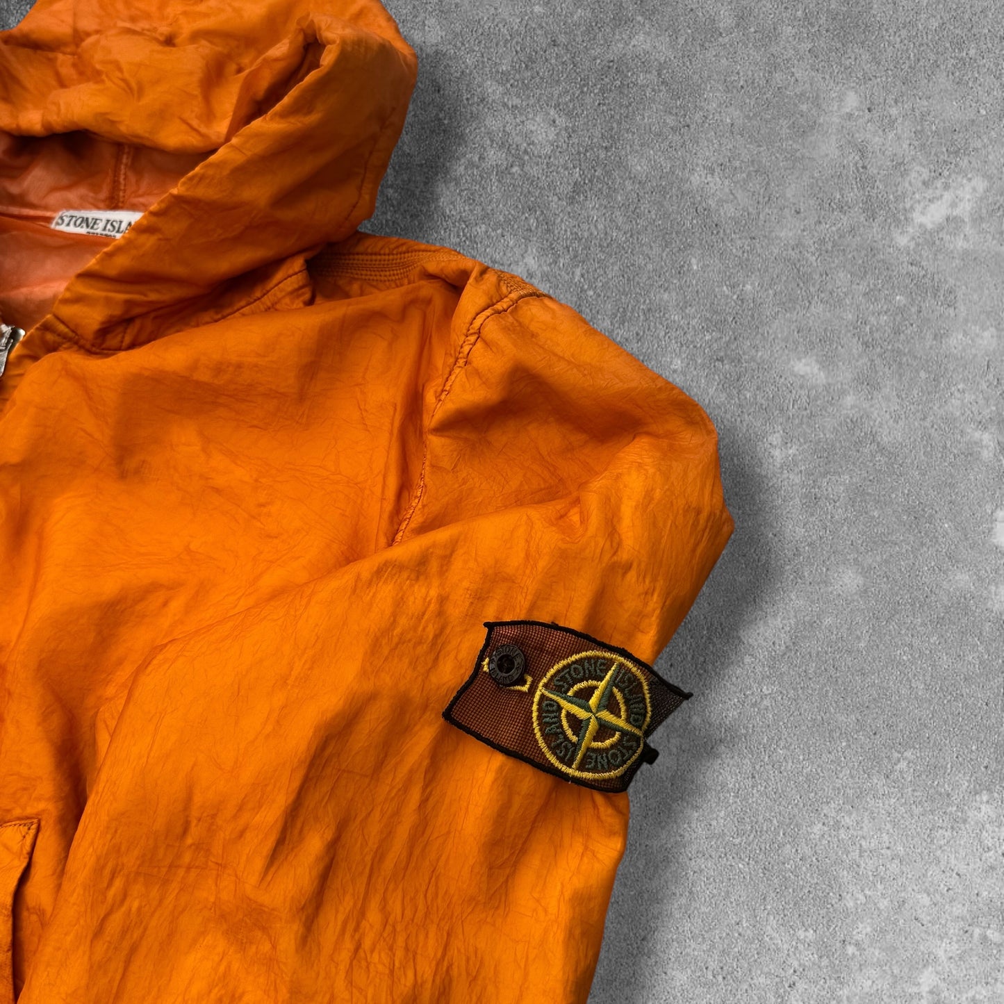 Stone Island SS 2008 Superlight Resined Nylon Hooded Jacket, Drawstring hood. Full zip fastening with storm flap. Two diagonal front pockets with hidden snap fastening. Elasticated cuffs and hem. Mesh badge. Orange, xxl but fits xl to

ART. 48154833/1453