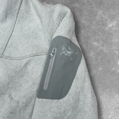 Covert Cardigan sleeve pocket and logo